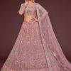 Pearl pink net lehenga choli with zari and thread embroidery by Pramukhmart