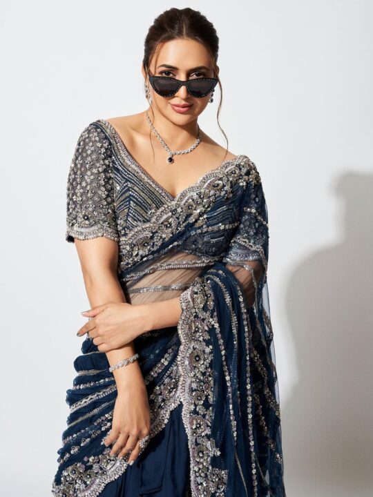 Front view of designer lehenga saree with embroidered pallu and stitched blouse