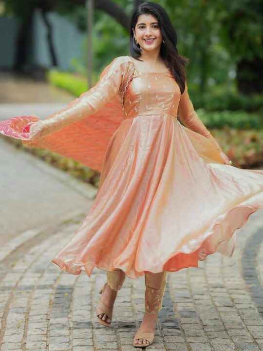 Woman wearing Chinnon Anarkali suit set in silk with embroidery – Pramukhmart