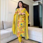 Woman wearing Sanganeri cotton kurti set with embroidered neck and dupatta – Pramukhmart