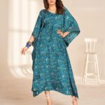 Woman wearing long printed kaftan in soft French crape with adjustable belt