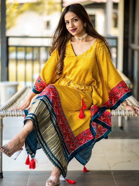 Woman wearing Gaji silk kaftan with digital print and gota patti lace