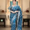 Woman wearing soft lichi silk saree with jacquard design and contrast brocade blouse