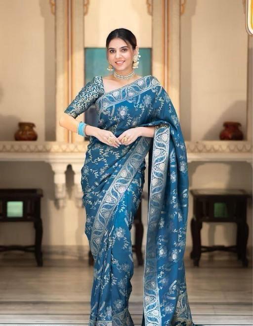 Woman wearing soft lichi silk saree with jacquard design and contrast brocade blouse