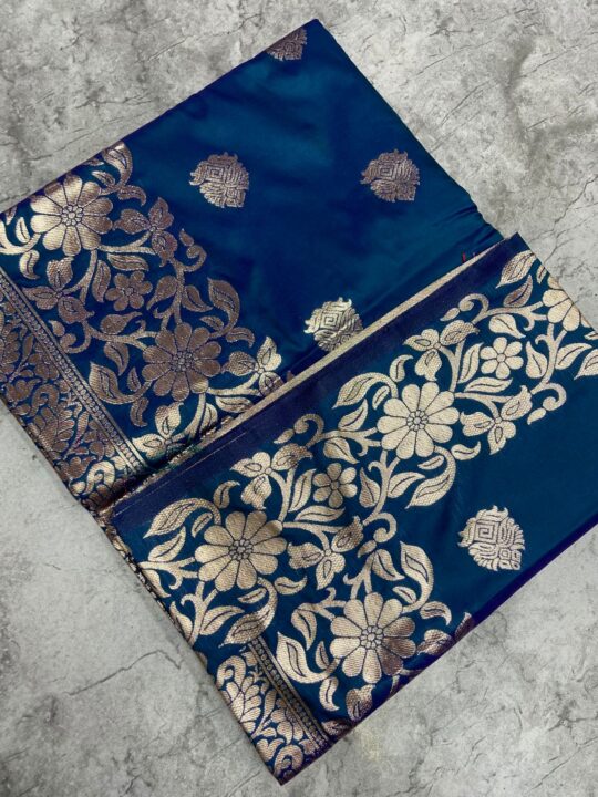Close-up of pure soft silk saree fabric and intricate zari work
